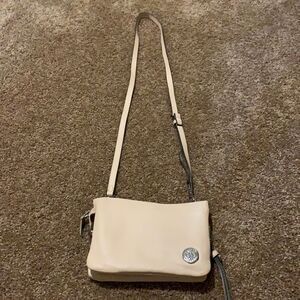 Vince Camuto soft pink crossbody wristlet.
